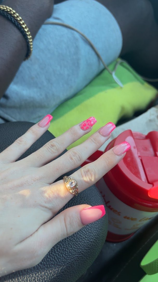 Close-up of manicured nails on display